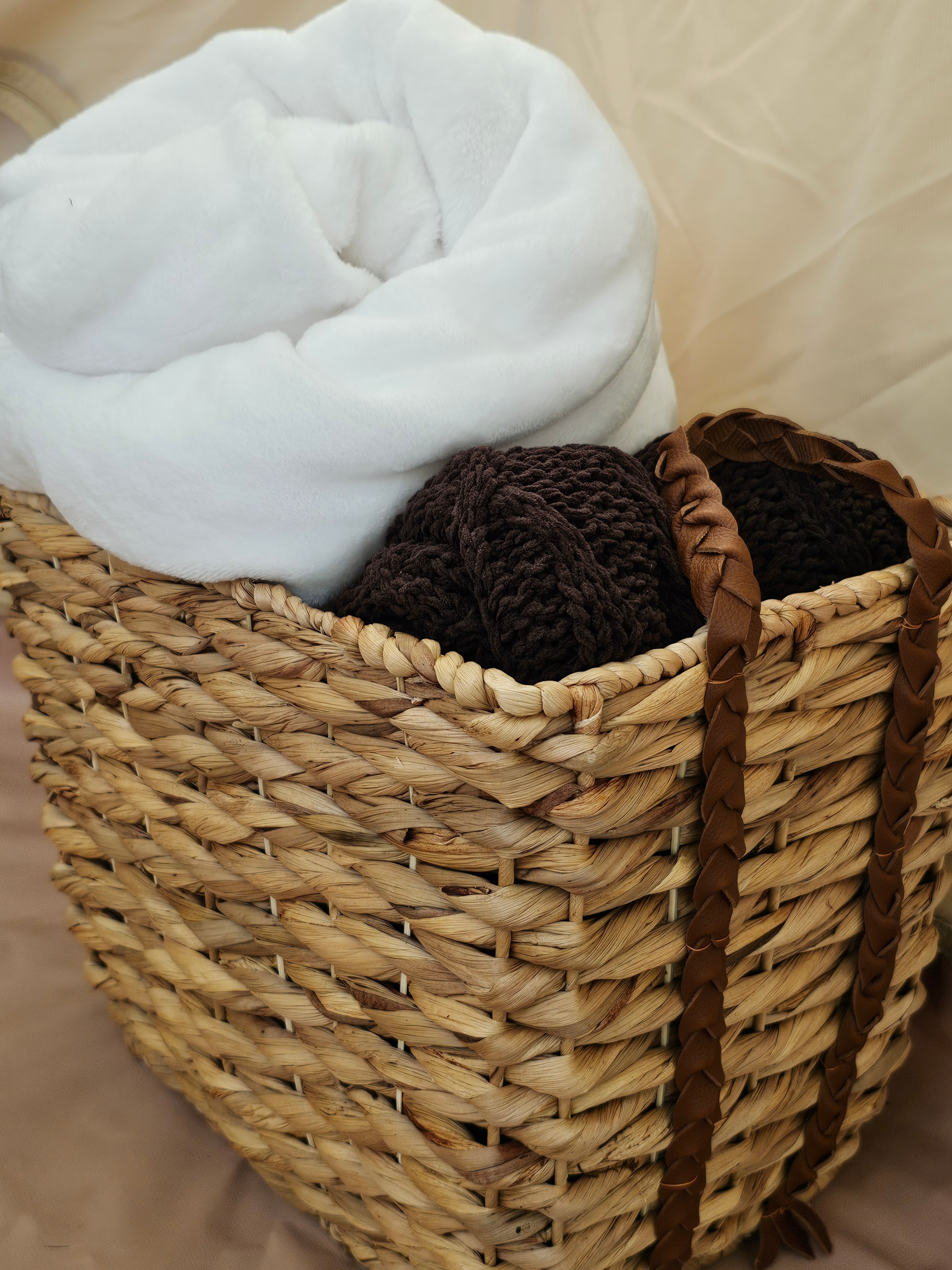 Woven basket with folded textiles
