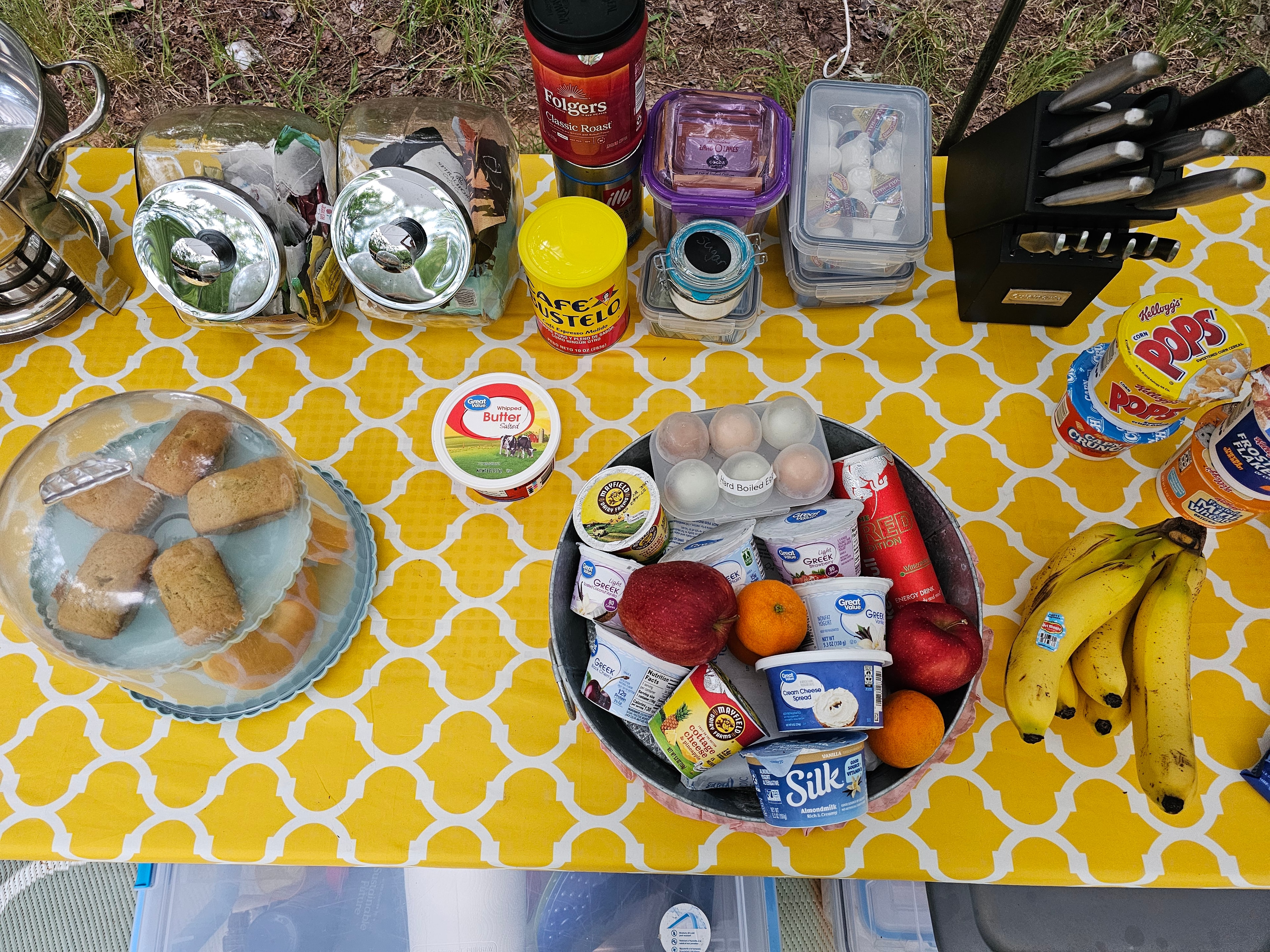 Outdoor picnic spread with cookware